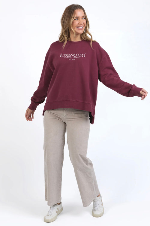 model wears burgundy sweater jumper by foxwood