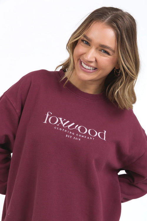 model wears burgundy sweater jumper by foxwood