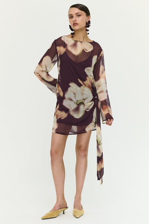 Woman wearing a floral dress on a white background