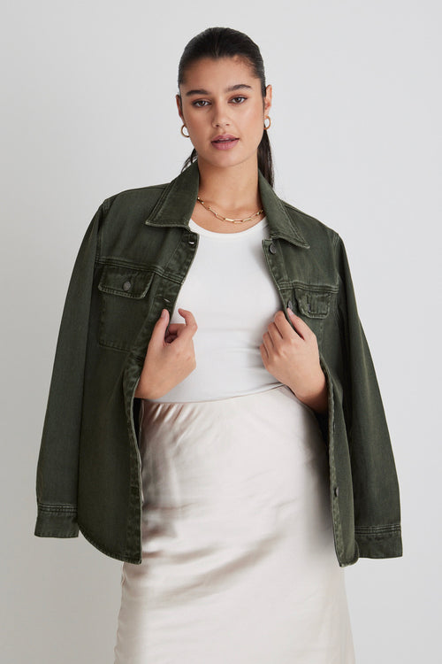 Model wears a green denim shacket