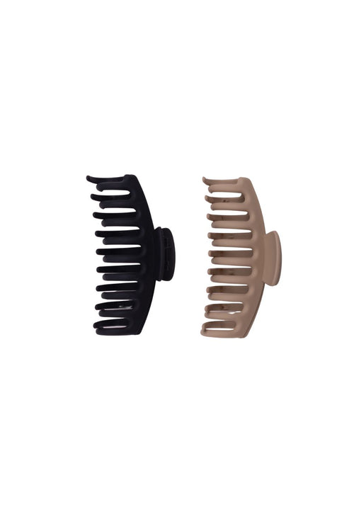 Two hair clips, one black and one beige, on a white background