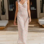 Woman wearing a cream red polka dot dress