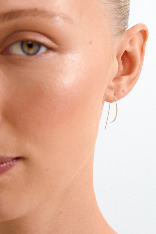 Close-up of a woman's face with a minimal background