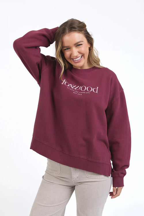 model wears burgundy sweater jumper by foxwood