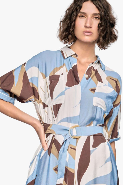 model wears a blue white brown pattern midi shirt dress
