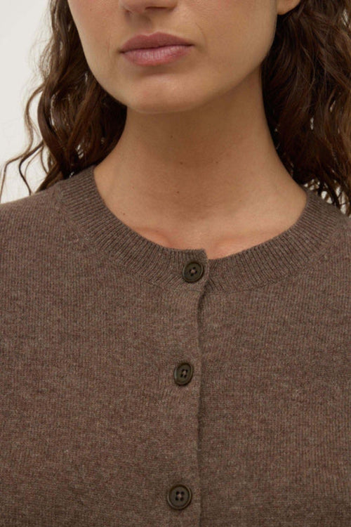Woman wearing a brown wool cardigan