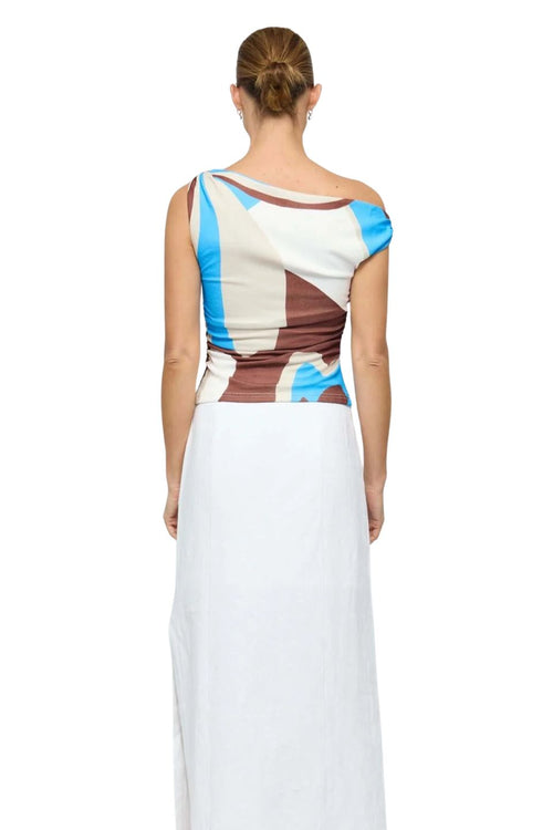 Woman wearing a colorful dress with a white background