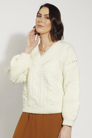 Model wears a white knit jumper