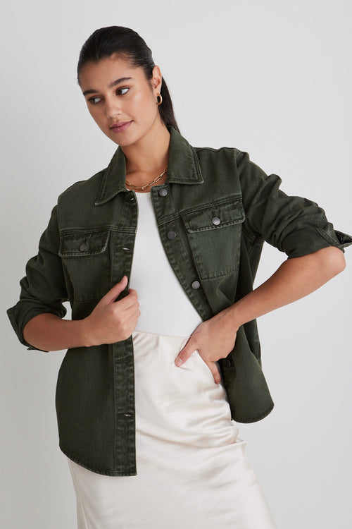 Model wears a green denim shacket