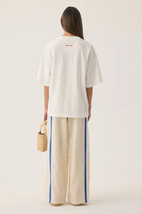 Woman wearing Tropiques Oversized Tee Warm White