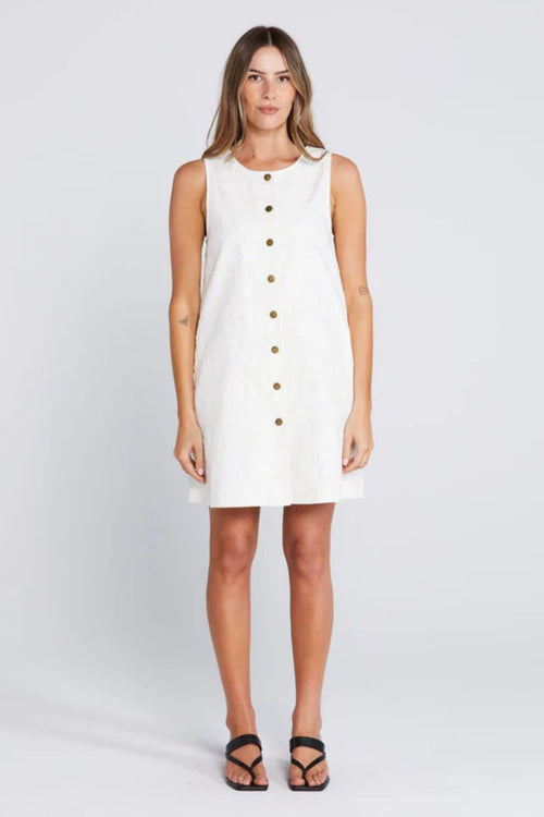 Woman wearing a light floral button down mini dress