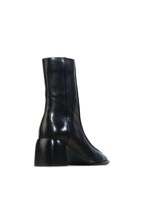 Black leather boot on a white background