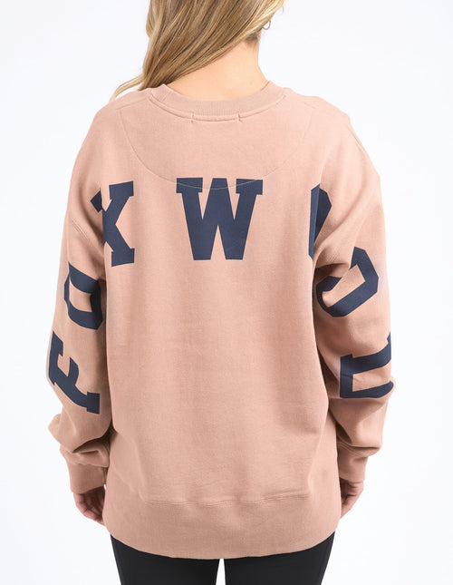Model wears tan foxwood crewneck jumper