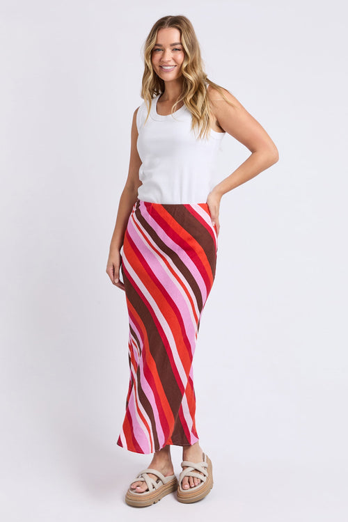 Woman wears a colourful stripe skirt