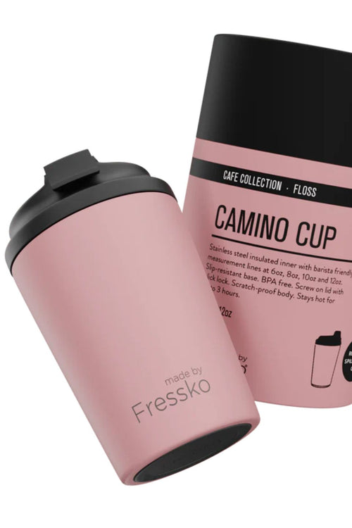 Pink insulated tumbler with black lid and 'made by Fressko' branding, next to its packaging on a white background.