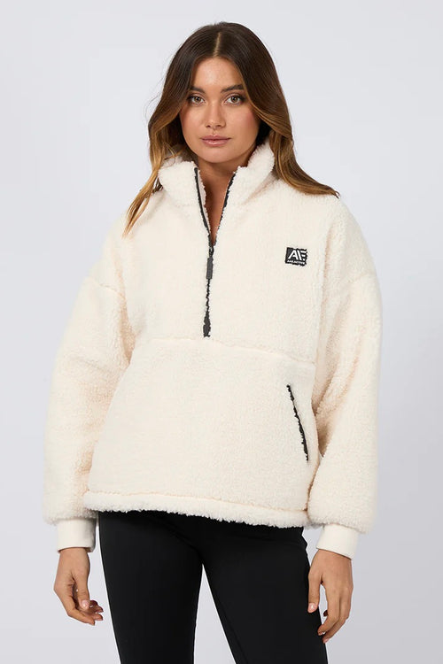 model wears a white teddy sweatshirt