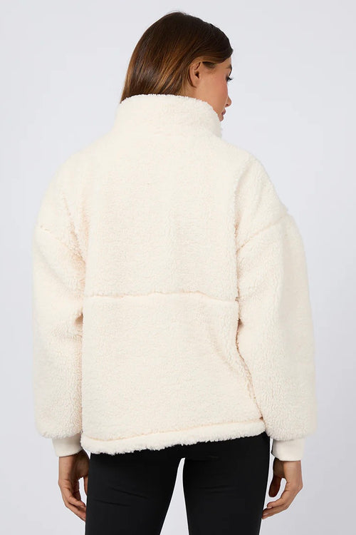 model wears a white teddy sweatshirt