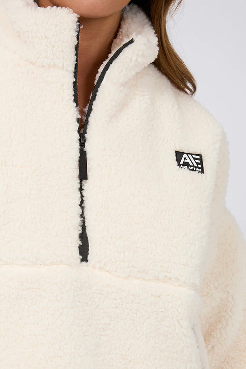 model wears a white teddy sweatshirt