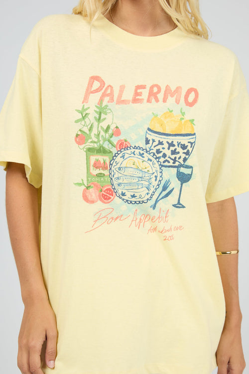 Yellow t-shirt with 'Palermo' graphic design on a plain background