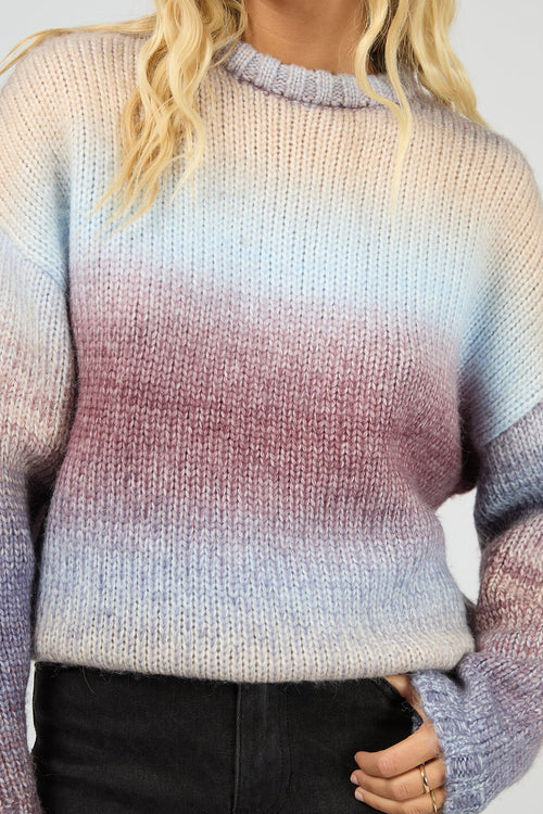 Gradient sweater worn by a person with a neutral background