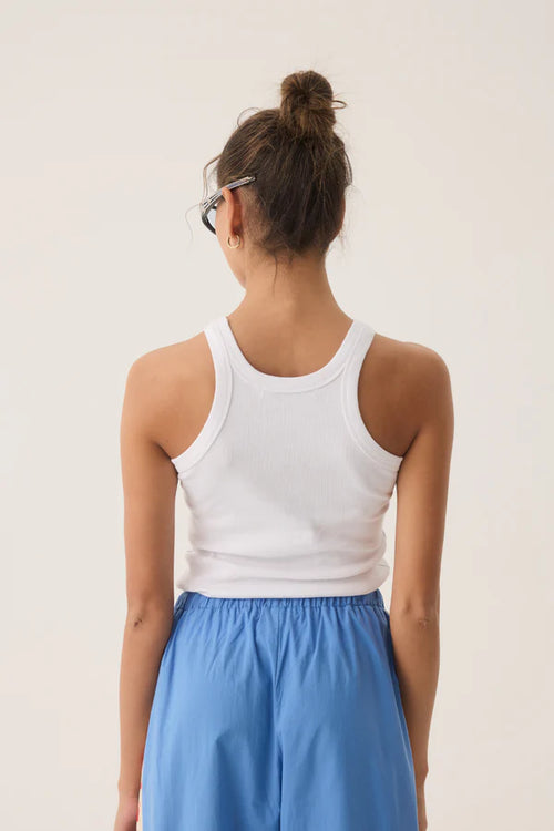 woman wearing a white tank top with a lobster print