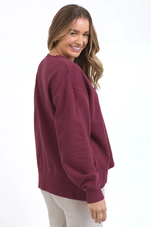 model wears burgundy sweater jumper by foxwood