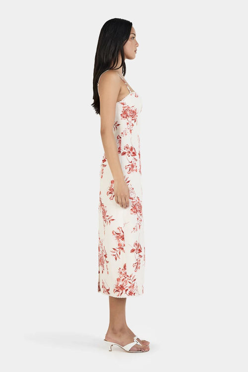 Woman wearing a floral dress on a white background