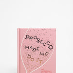 Front cover of a pink book titled 
' Prosecco Made Me Do It' by Amy Zavatto