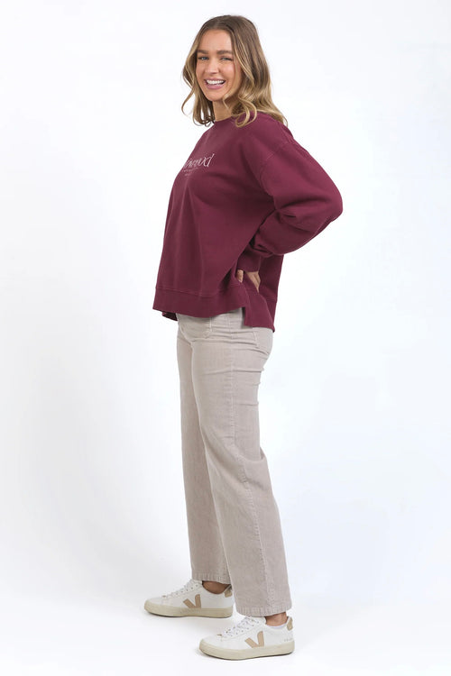 model wears burgundy sweater jumper by foxwood