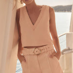 Woman wears a pink coral short