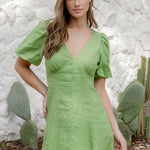 model wearing green dress