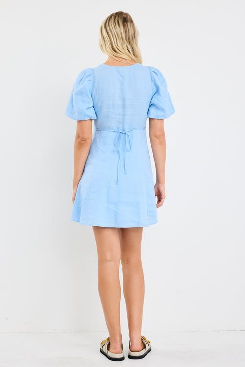 Model wears a short sleeve light blue mini dress