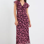 Woman wearing a purple floral dress on a white background