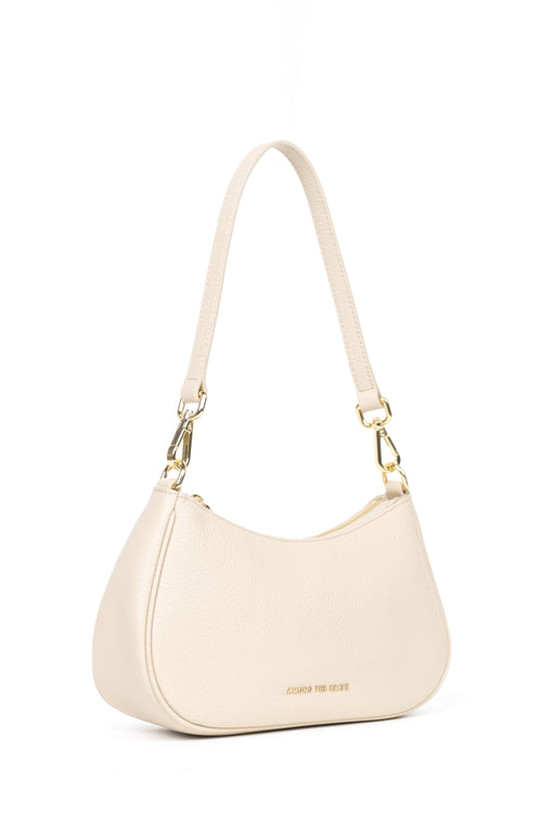 An off-white crescent-shaped shoulder bag with a matching fabric strap and gold-tone hardware, shown against a plain white background.