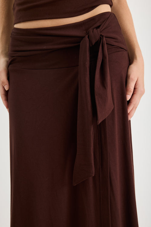 Woman wearing a brown ruched set