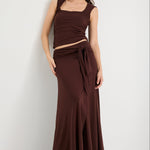 Woman wearing a brown ruched set