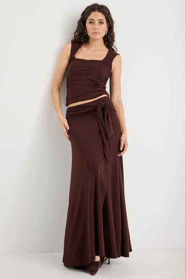 Woman wearing a brown ruched set