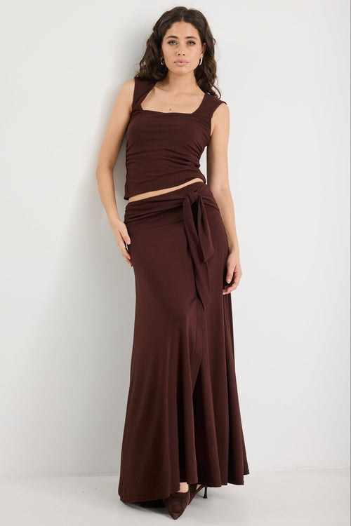 Woman wearing a brown ruched set