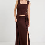 woman wearing a brown ruched set 