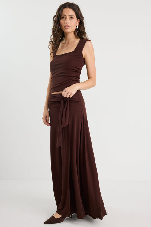 Woman wearing a brown ruched set