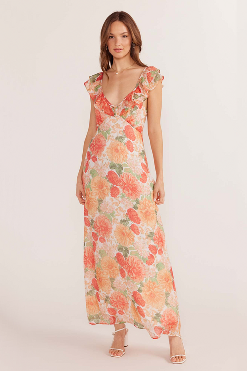 model wears floral pink and orange maxi dress