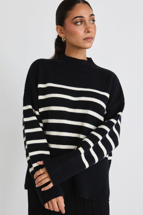 model wears a black stripe knit