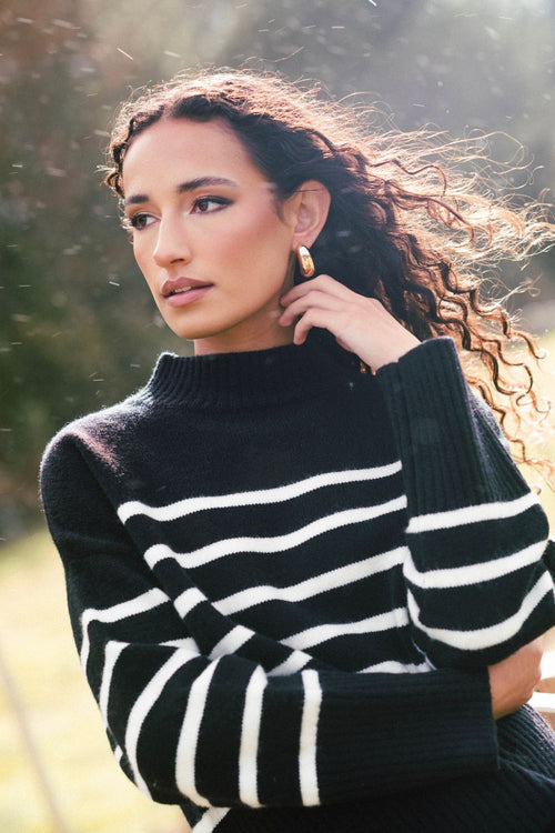 model wears a black stripe knit