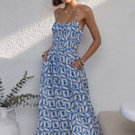 model wears a blue white print maxi dress