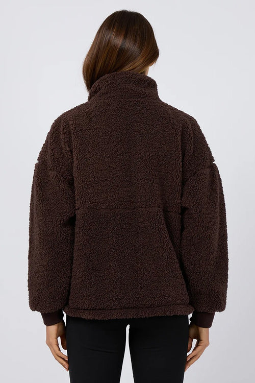 model is wearing a brown teddy sweatshirt
