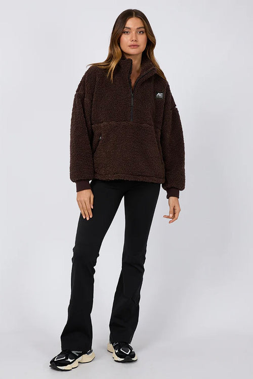 model is wearing a brown teddy sweatshirt