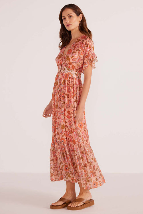 model wears a pink floral midi dress