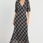 Woman wearing a check midi dress