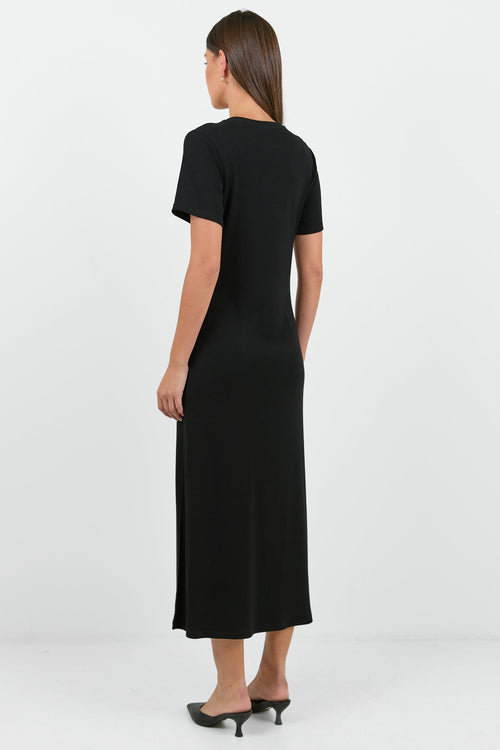Woman wearing a black dress on a white background