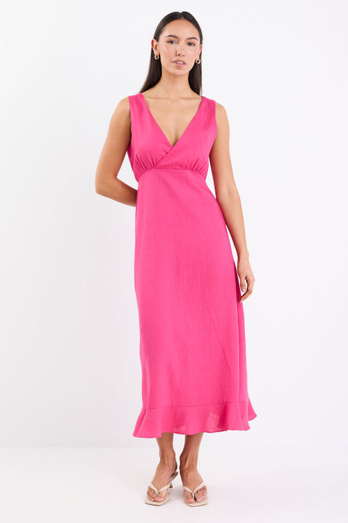 Woman wearing a bright hot pink sleeveless midi dress with a V-neckline, bias-cut silhouette, and soft flare hem.